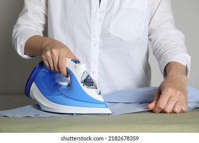 Woman ironing clean shirt on board, closeup - Shutterstock ID 2182678359