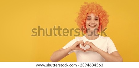 Woman isolated face portrait, banner with copy space. symbol of love. april fools day. time for fun. girls birthday party. happy funny woman in curly wig.