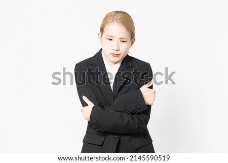 A woman in a jacket who is tired due to poor physical condition