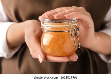 Woman with jar of delicious jam, closeup - Shutterstock ID 1611019966