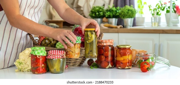 Woman Jar Preserve Vegetables In The Kitchen. Selective Focus. Food.