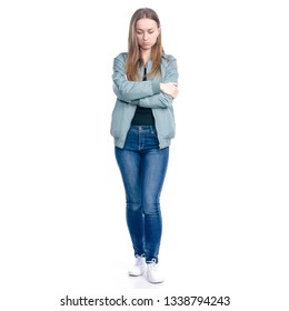 Woman In Jeans And Green Jacket Standing Offended On White Background Isolation