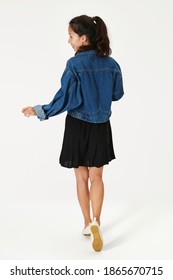 Woman In Jeans Jacket Back View