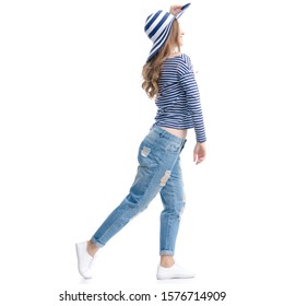 Woman in jeans and vest with sunhat smile goes walking on white background isolation - Powered by Shutterstock