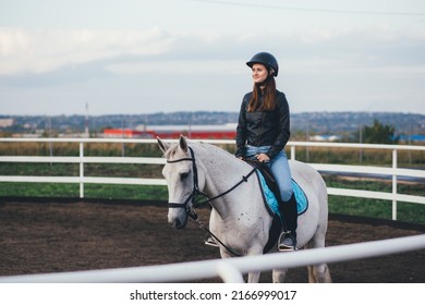 Woman Jockey Riding White Horse