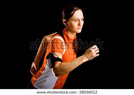 Similar – Close up front upper body portrait of one middle age athletic woman in sportswear in gym over dark background, looking at camera and smiling