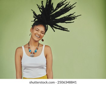 Woman, joyful and dreadlocks in studio for fashion, stylish clothes and cool look with confidence. Female person, jewelry or trendy accessory by mockup space for laughing, dancing or green background - Powered by Shutterstock