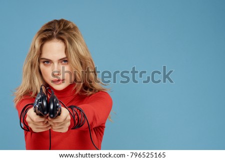woman with joysticks on a blue background                               