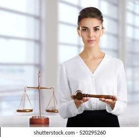 Woman With Judge Gavel At Office. Law And Justice Concept.