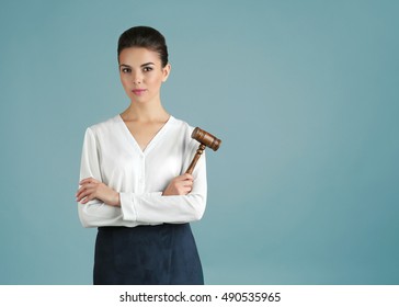 Woman With Judge Gavel On Gray Background