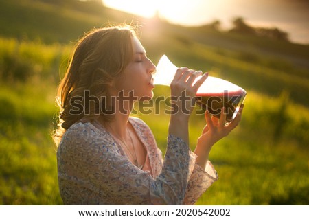 Woman with a jug of sparkling wine