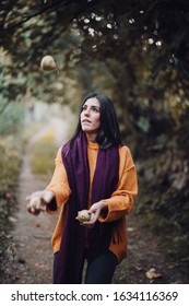 Woman Juggling Some Pears In The Field