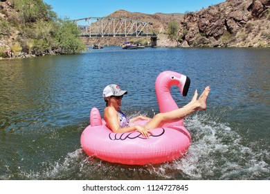 Woman Jump Jumping Into A Pink Flamingo Floatie