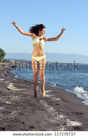 Woman jump on beach