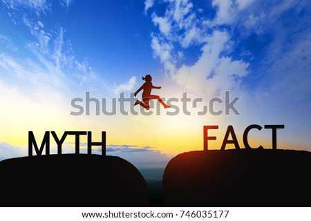 Woman jump through the gap between Myth to Fact on sunset.