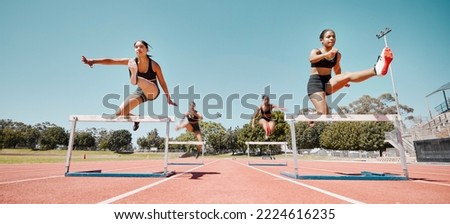 Woman, jumping and hurdles in competitive sports training, exercise or athletics on the stadium track. Women in sport fitness competition for hurdle jump, running and fast cardio exercising outside