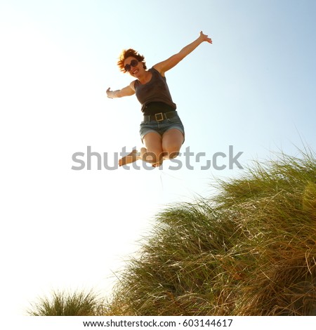 woman jumping for joy/jumping for joy/ woman jumping for joy Stock photo © 