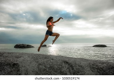 Woman Jumping On Rock Sunset On Stock Photo Shutterstock