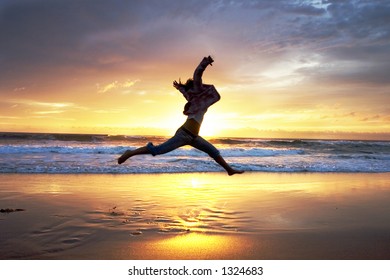 Woman jumps at sunrise - Powered by Shutterstock