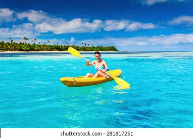 Woman Kayaking In The Ocean On Vacation In Tropical Fiji Island