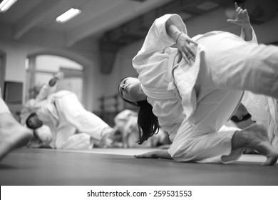 Woman Keeping Balance At Martial Arts Training