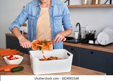 Woman keeping organic waste for making a compost - Powered by Shutterstock