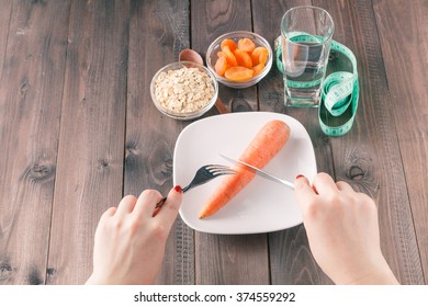 Woman Keeping A Strict Diet And Eating Vegetables