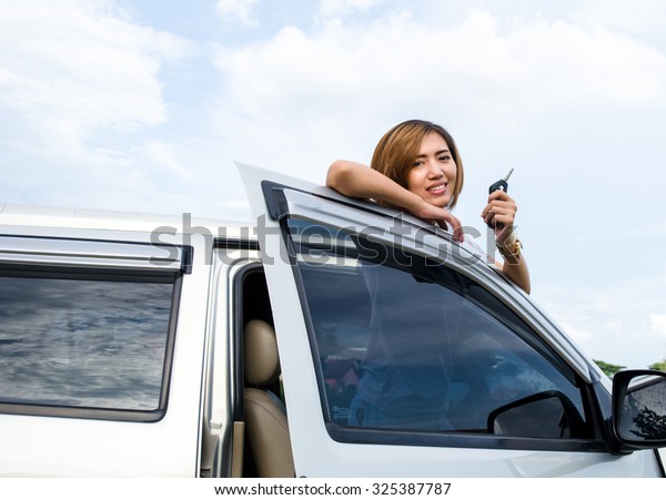 Woman and key of\
car