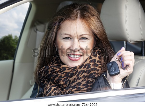 woman with keys of new , hire or rental car or just
passed driving test