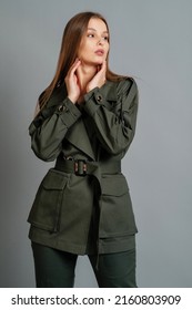 Woman In A Khaki Pantsuit. Women Clothing.