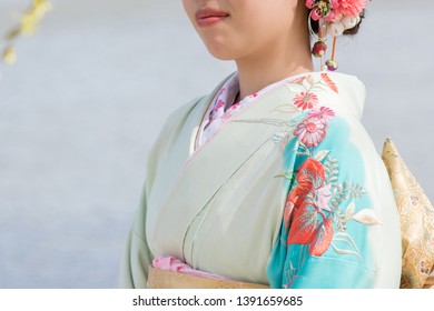 Woman In A Kimono(The Girls Prepare A Kimono Known As Furisode For Their Coming Of Age Ceremony.)