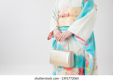 Woman In A Kimono(The Girls Prepare A Kimono Known As Furisode For Their Coming Of Age Ceremony.)