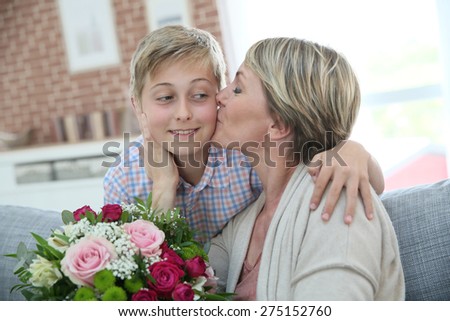 Woman kissing little boy on mother's day
