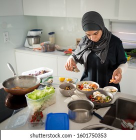 Woman In Kitchen Preparing Healty Organic Food