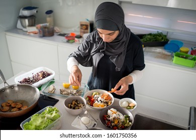 Woman In Kitchen Preparing Healty Organic Food