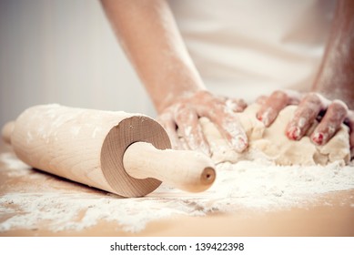 Woman kneading dough, close-up photo - Powered by Shutterstock