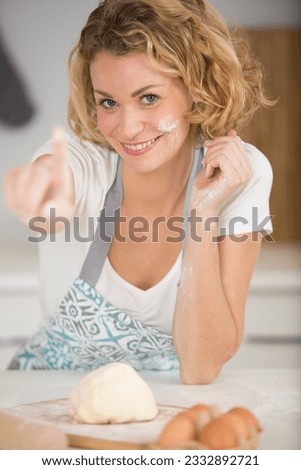 woman kneading dough close-up photo