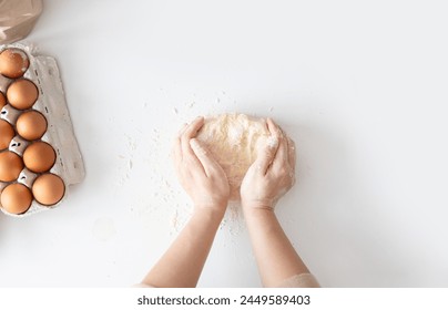 Woman kneading dough for Italian Grissini at white table in kitchen, top view. - Powered by Shutterstock