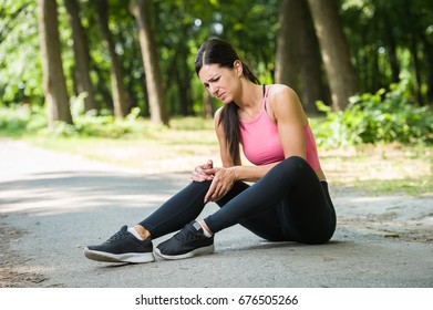 Woman Knee Pain In A Park