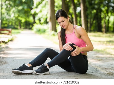 Woman Knee Pain In A Park