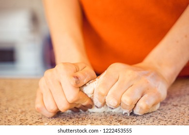 Woman Kneeding Dough