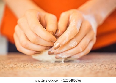 Woman Kneeding Dough