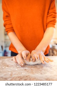 Woman Kneeding Dough