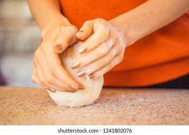 Woman Kneeding Dough