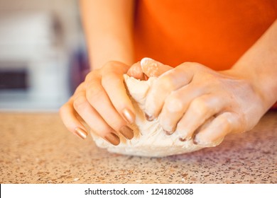 Woman Kneeding Dough