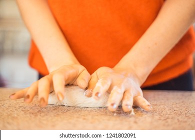 Woman Kneeding Dough