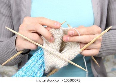 Woman Knitting Blue Socks Closeup