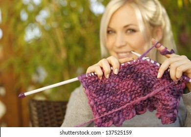 Woman Knitting On Terrace