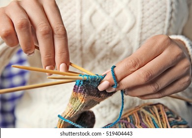 Woman Knitting Small Socks