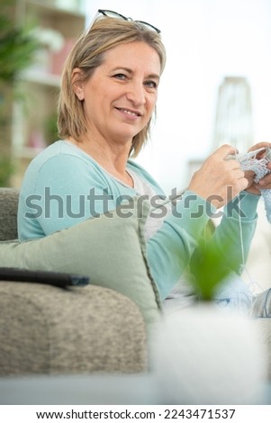 Similar – Caregiver looking through the window with elderly patient in wheelchair